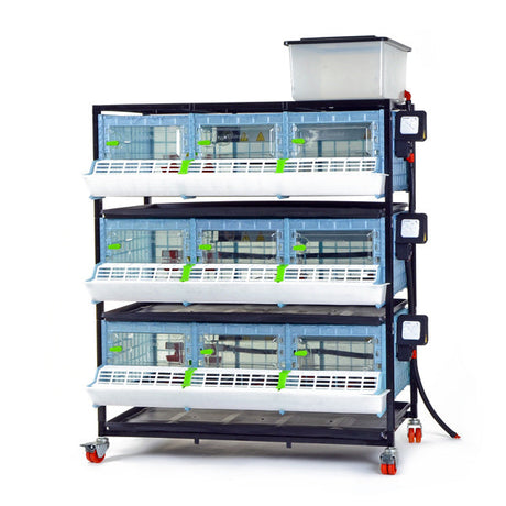 Hatching Time Cimuka CB25 3 layer brooder visible with feeding trough, manure trays and water reservoir tank visible.