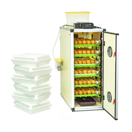 Hatching Time Cimuka CT180 egg setter and hatcher. Cimuka incubator is seen in image with the door open and full egg setter trays inside with brown eggs. A digital control is on top of the incubator in front of a water reservoir tank connected to a Humisonic Humidifier. White hatching baskets are beside the incubator.