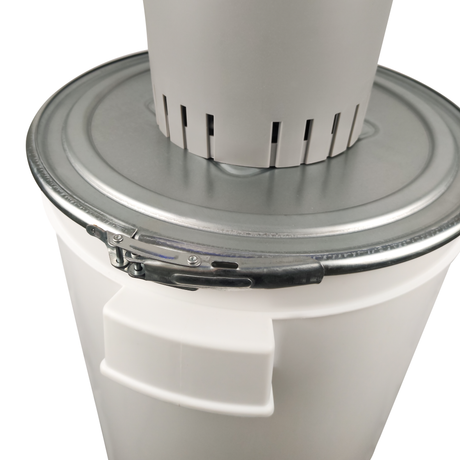 Close-up of Farm Mill 50 Feed Crusher showing metal clamp locking system securing the 50L plastic bucket lid to the motor base